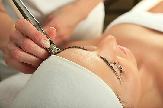 Microdermabrasion therapy
